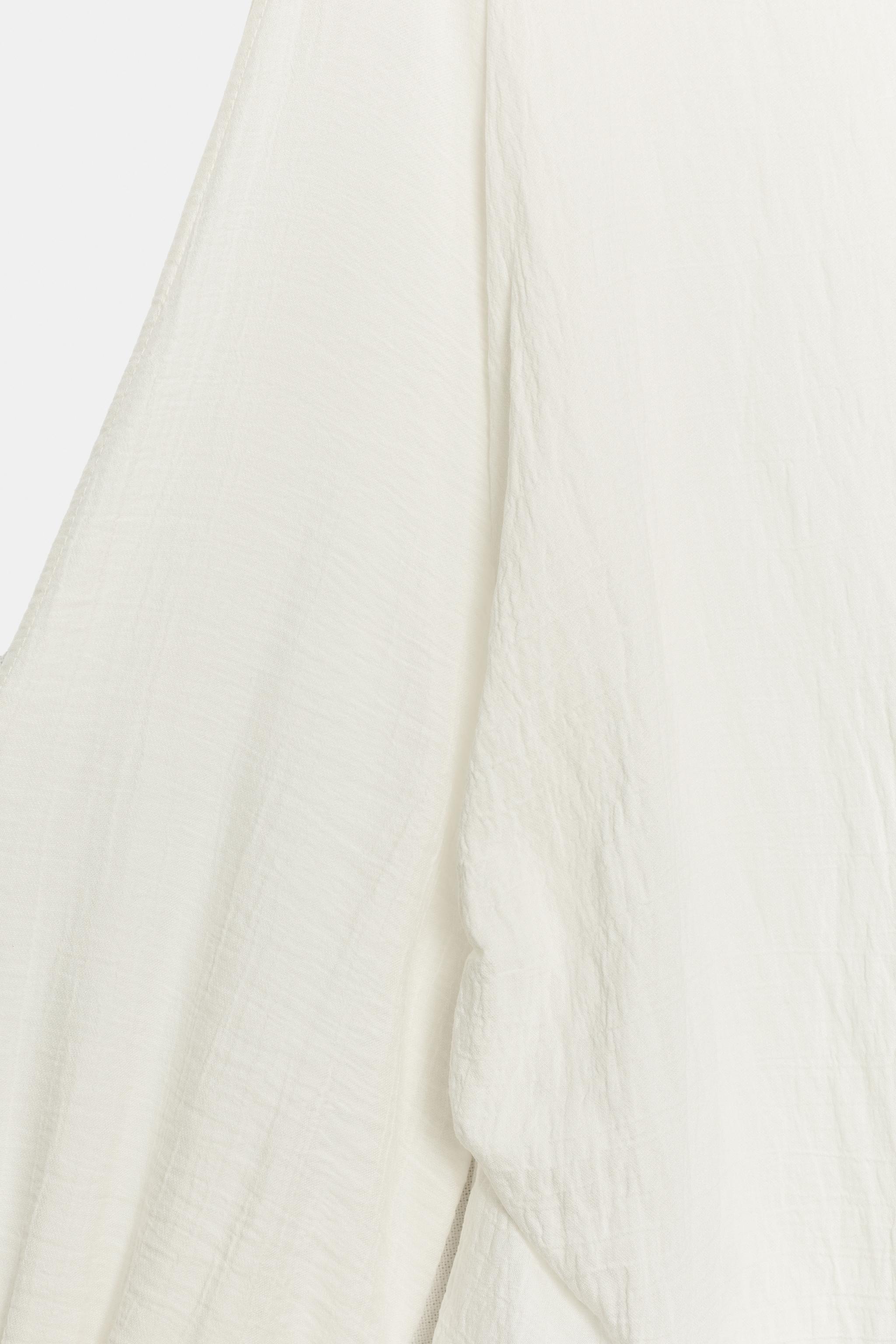 BLOUSE WITH SLEEVE SLITS